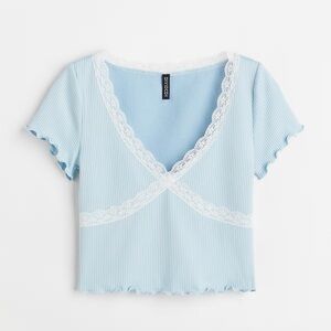 Light blue and white cropped tee with lace detail